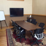 Excelerate Essex - Beautiful co-working space in Essex Junction Vermont - photo of conference area & table